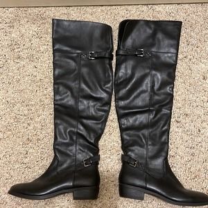 RIHANNA up to the Knee Black Boot with side zipper and double back button.